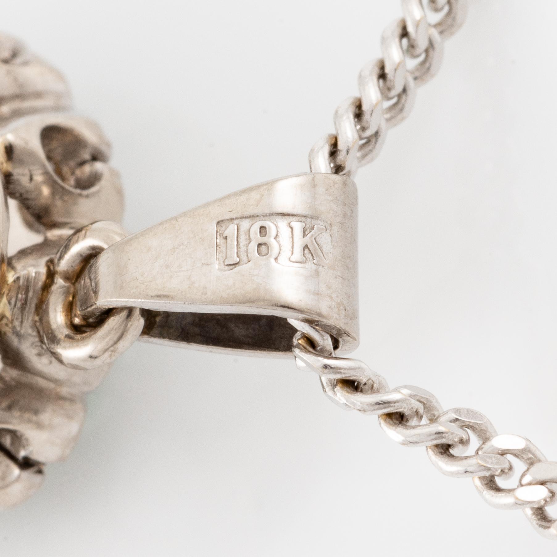 Necklace, 18K white gold with emerald and brilliant-cut diamonds.