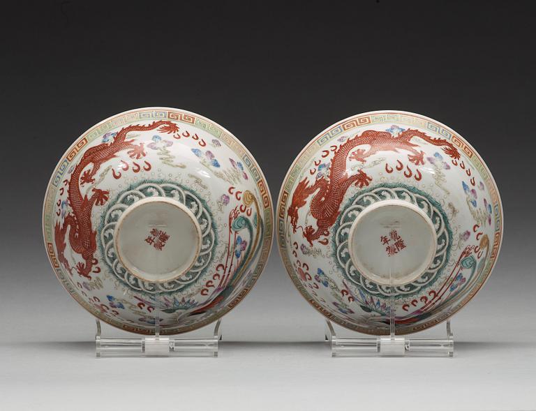 A pair of dragon and phoenix bowls, China, Republic with Qianlong mark.