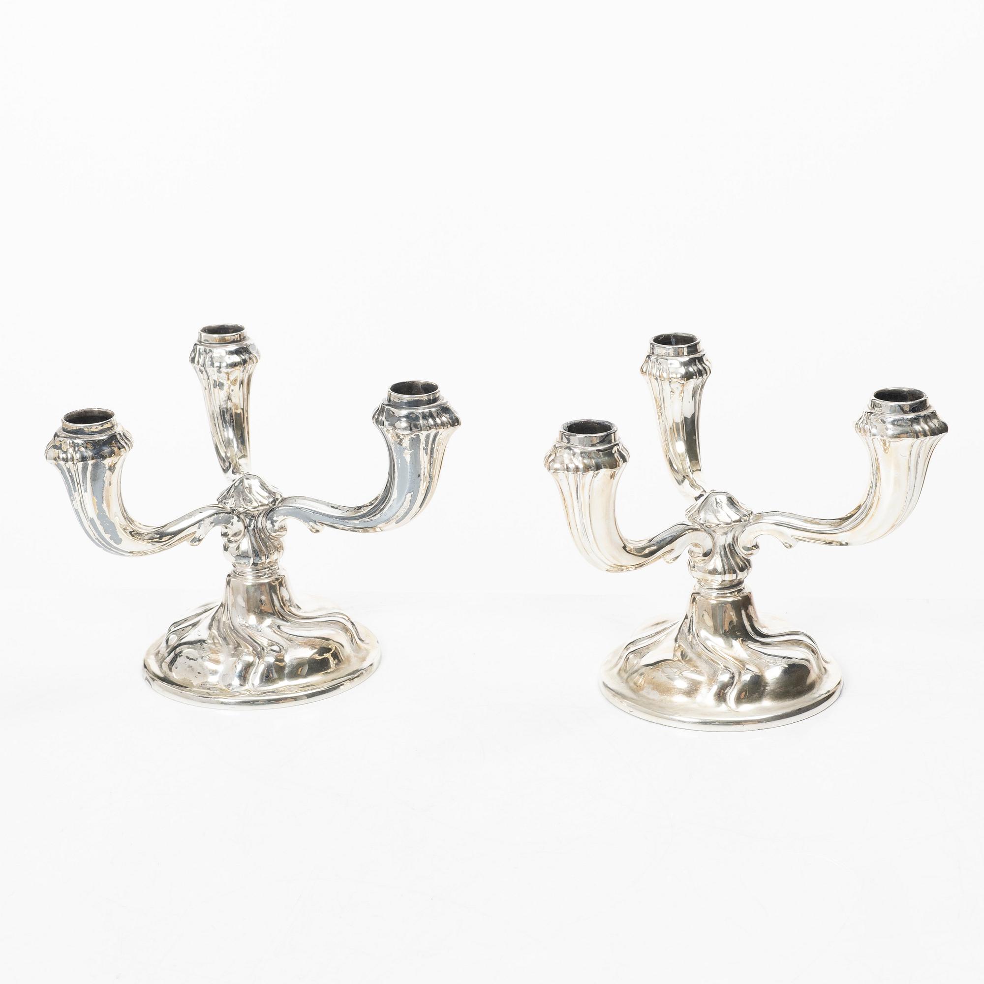 A pair of German silver candelabra, mark of Jakob Grimminger, Schwäbisch Gmünd, 20th century.