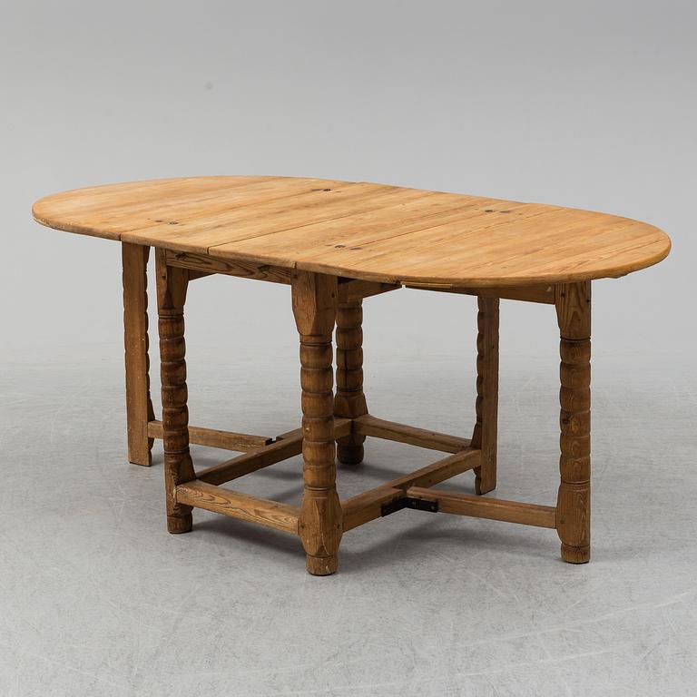 A 19th century pine gate leg table.