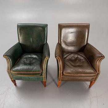 A set of two leather armchairs lat er part of the 20th century.