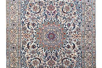 A Nain carpet, part silk, c. 293 x 199 cm.