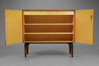 An Otto Schulz cabinet on stand with artificial red leather and brass details on a stained oak and birch stand, by Boet, Gothenburg, probably 1950's.
