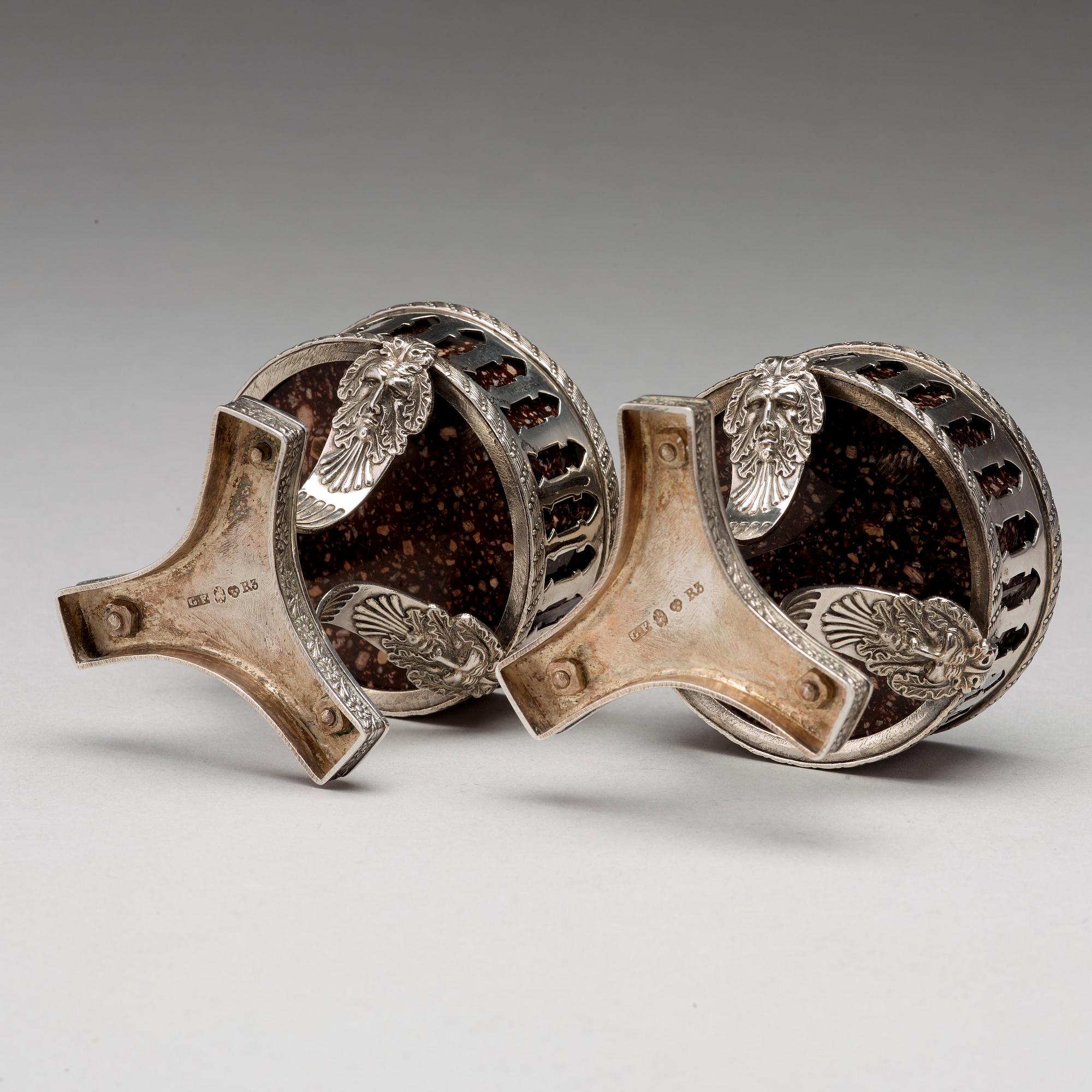 A pair of Swedish 19th century porphyry and silver salt-cellars, silver with mark of Gustaf Folcker, Stockholm 1823.