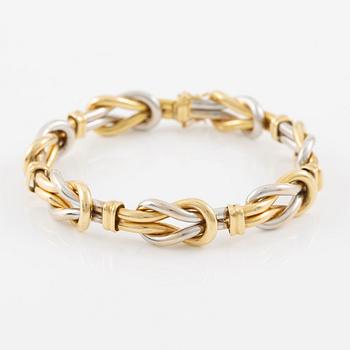A bracelet in 18K gold and white gold.
