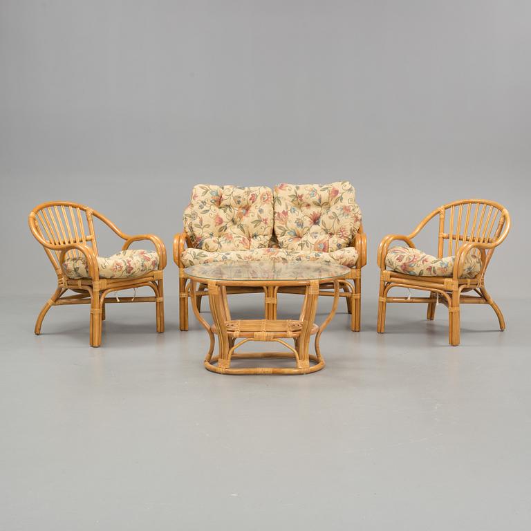 A set of sofa, easy chairs and table in four parts, late 20th century.