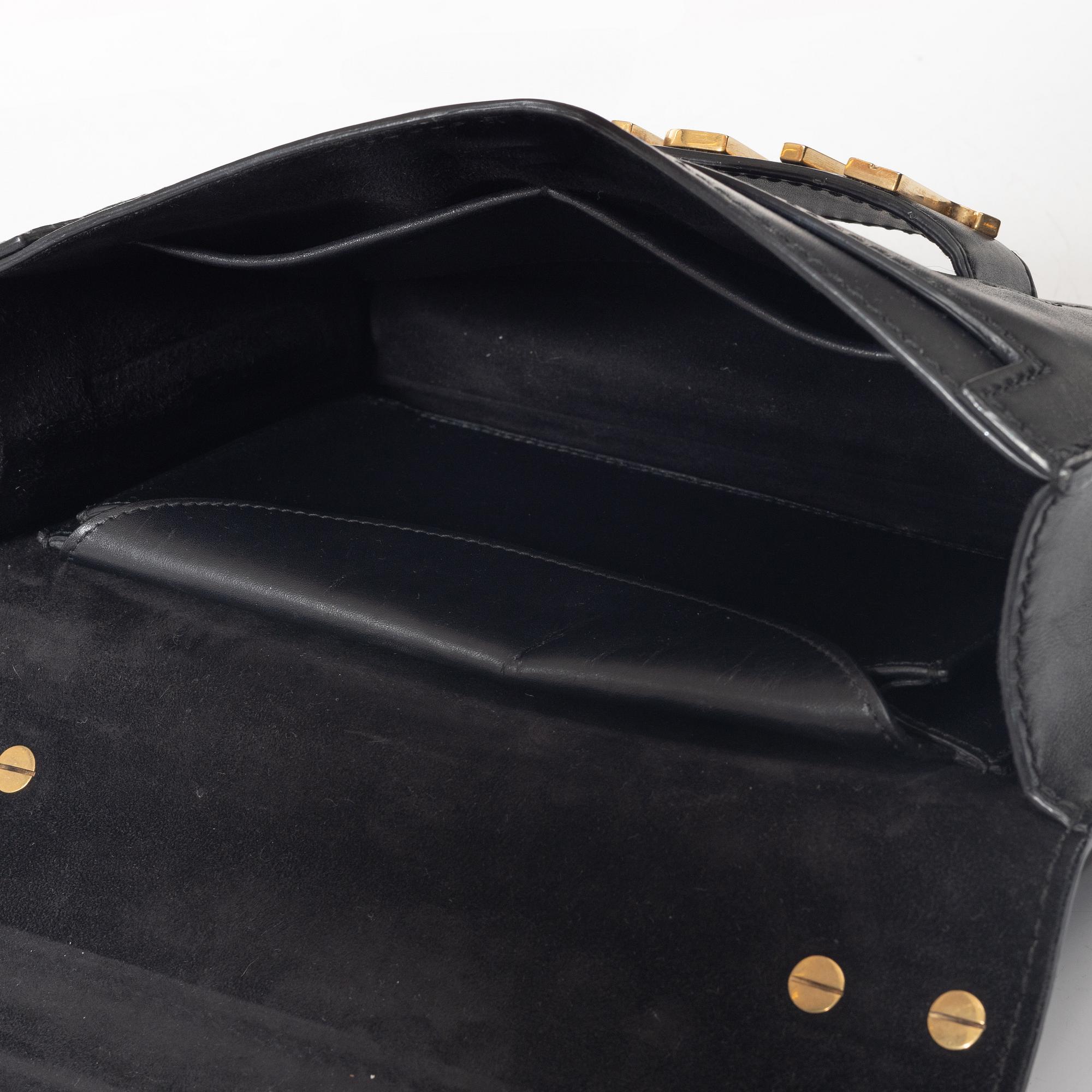 Christian Dior, A black leather "Dio(r)evolution" bag.