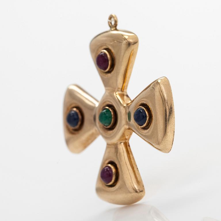 A 14K gold cross pendant, with cabochon-cut sapphires, rubies, and an emerald.