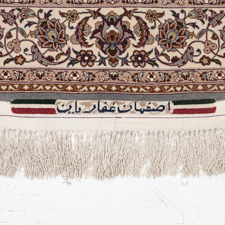 A semi-antique Isfahan rug, central Persia, signed Ghaffarian, c. 180 x 112 cm.