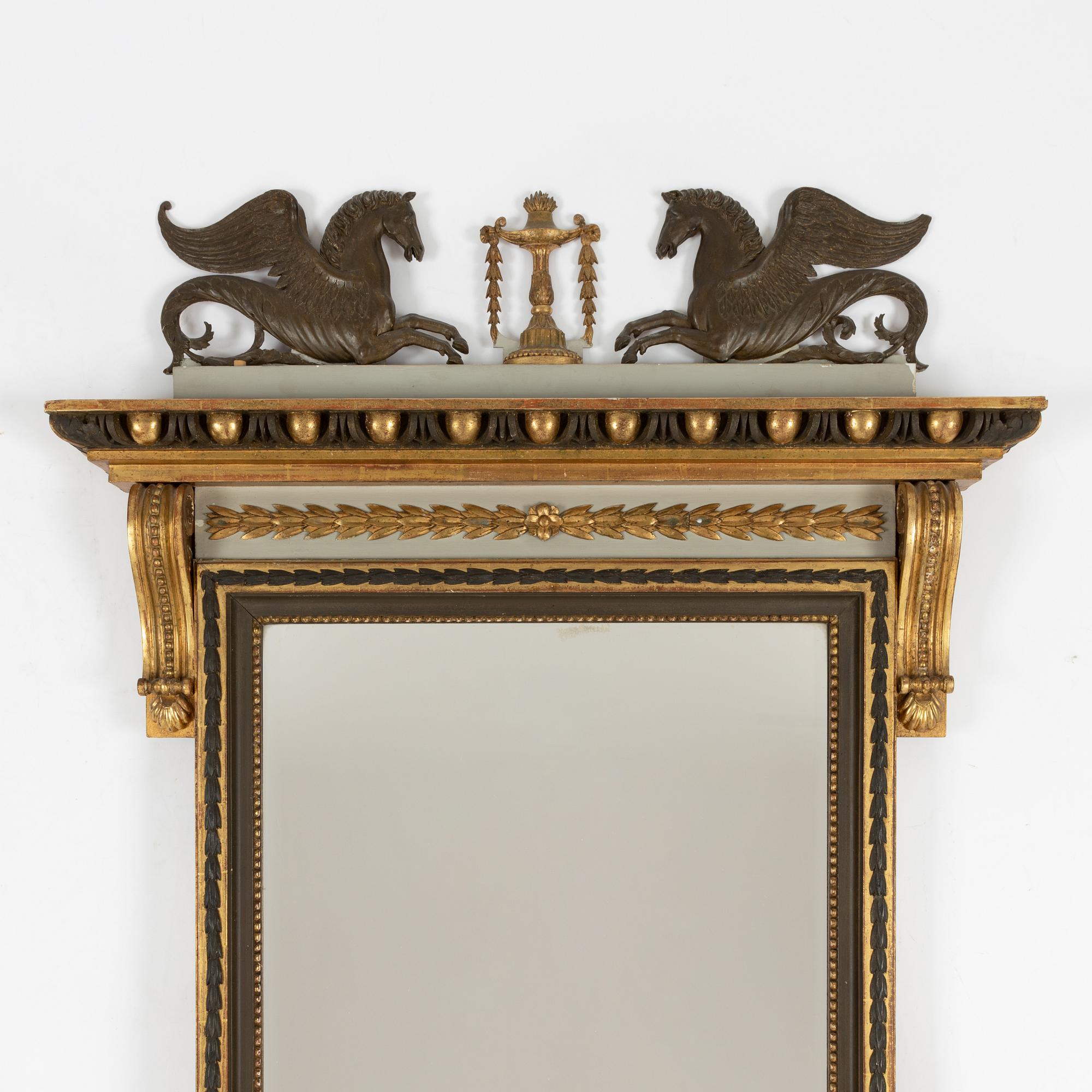 A Empire style mirror, late 19th Century.