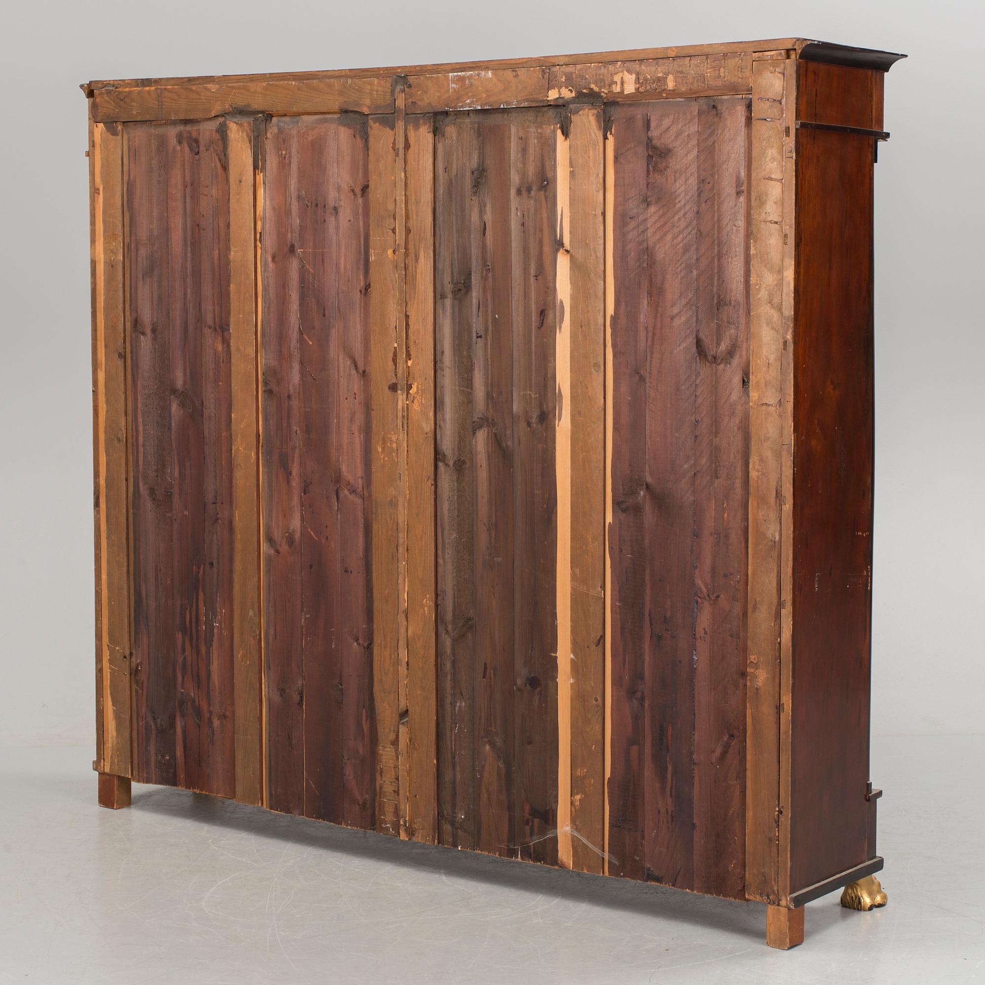 A mid 1800s Empire bookcase.