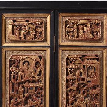 A set of four framed wooden panels, Qing dynasty, 19th Century.