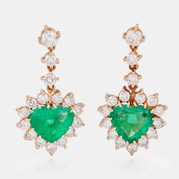 746. A pair of brilliant-cut diamond and heart-shaped emerald earrings.