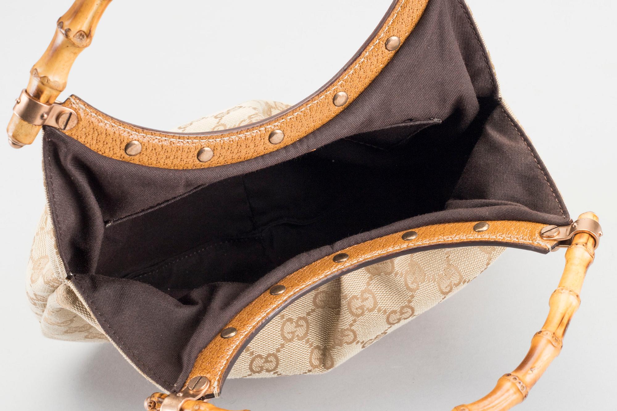 A GUCCI BAG, "STUDDED  BAMBOO HANDLE".