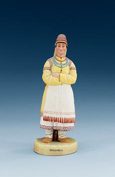 1343. A unmarked Russian bisquit figure depicting a Mordvinian woman, ca 1900.