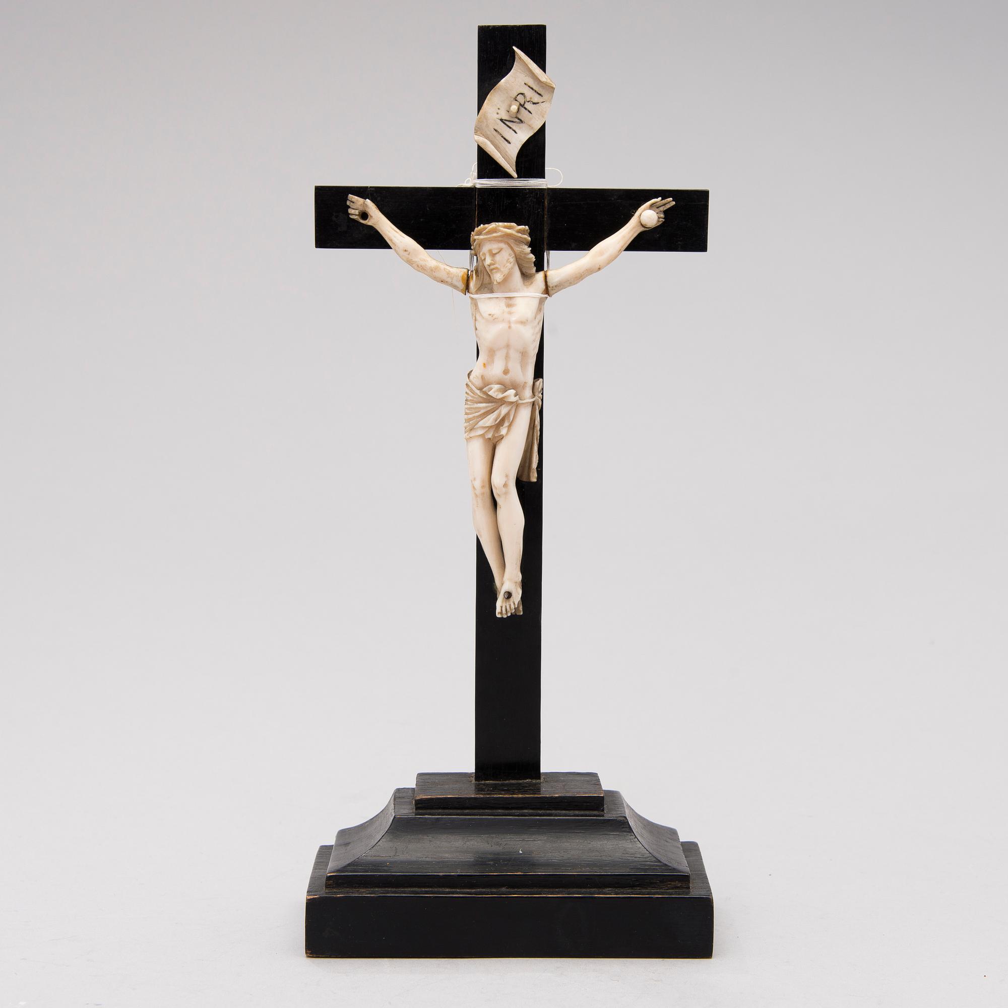 A WOODEN AND BONE TABLE CRUCIFIX with base. 19th Century.