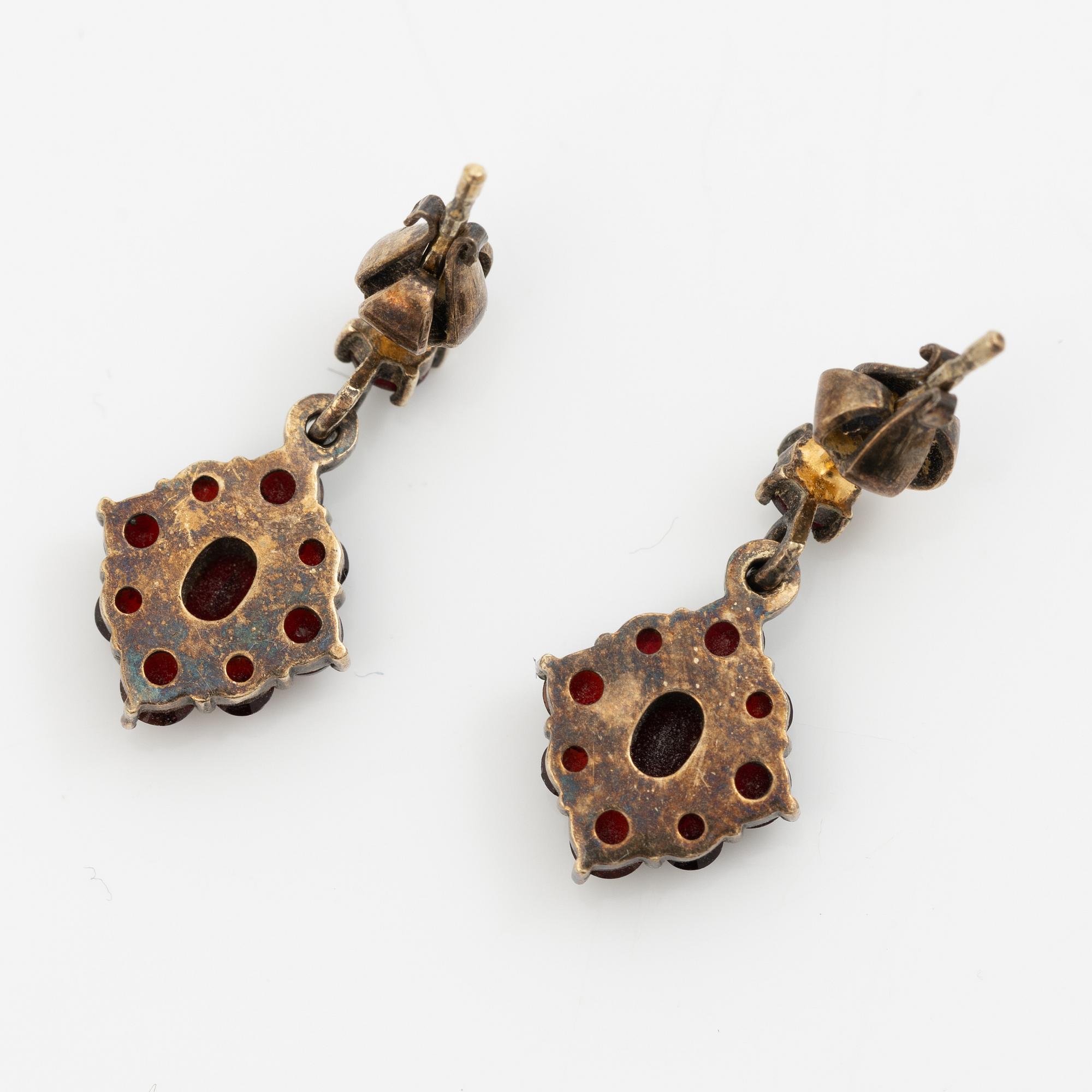 Pendant and a pair of earrings, gilt metal with garnets.
