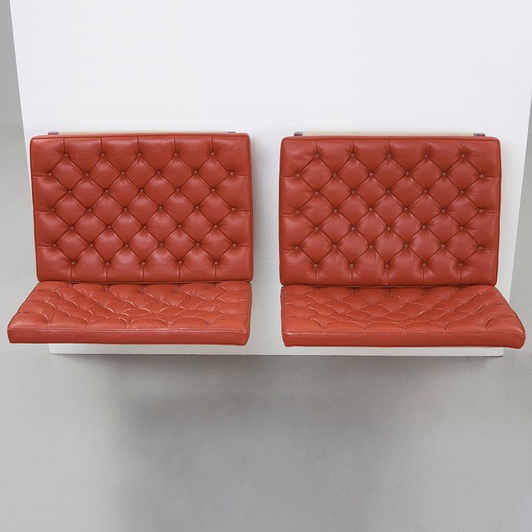 Poul Kjaerholm, A pair of "PK 26" wall mounted sofa sections, edition Fritz Hansen.