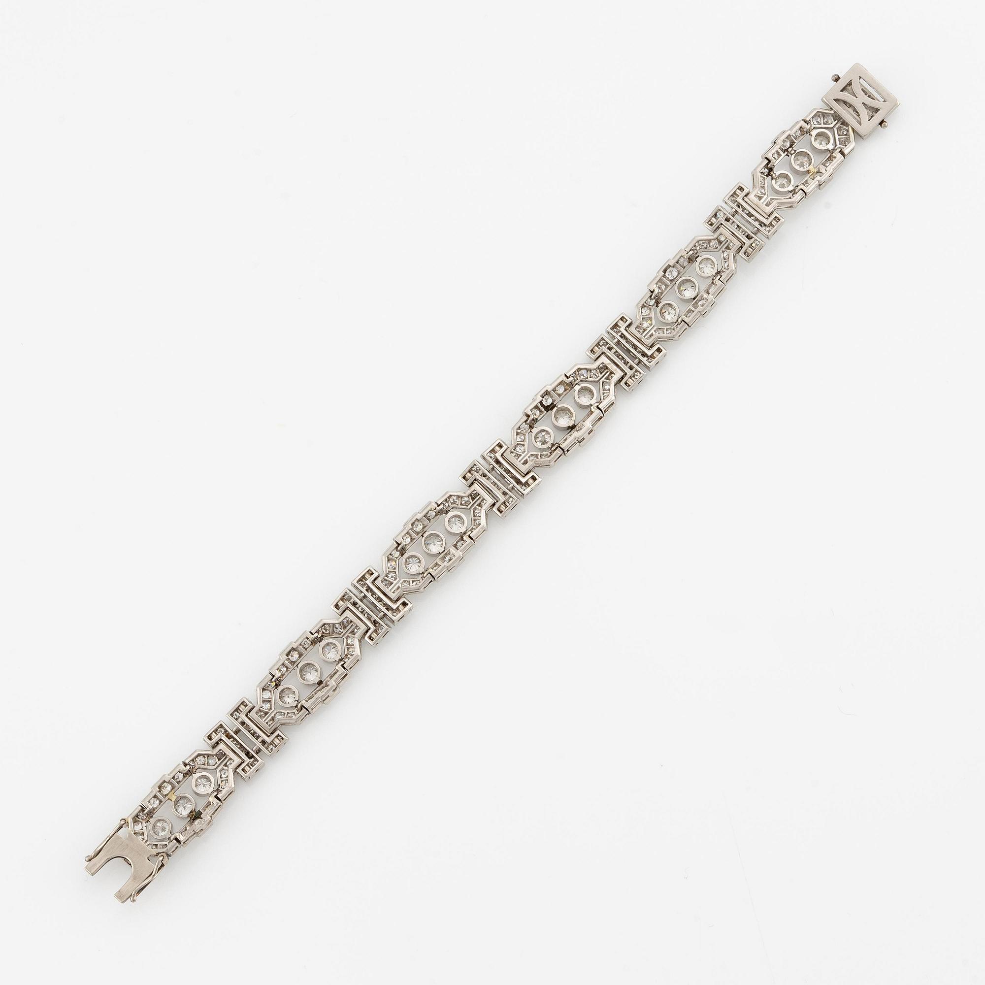 A platinum bracelet with round brilliant-and eight-cut diamonds.