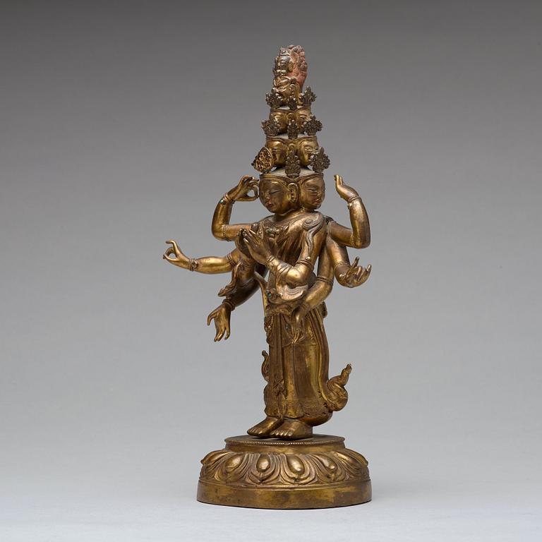 A Tibeto-Chinese gilt bronze figure of eleven-headed Avalokiteshvara, 19th Century.