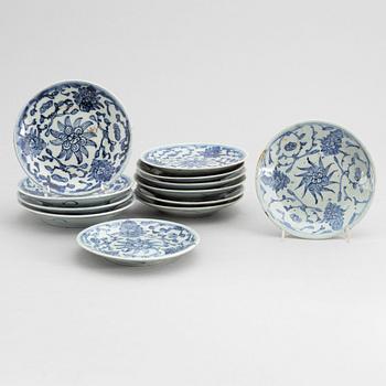 A set of 12 similar Chinese blue and white porcelain small dishes, late Qing dynasty, around the year 1900.