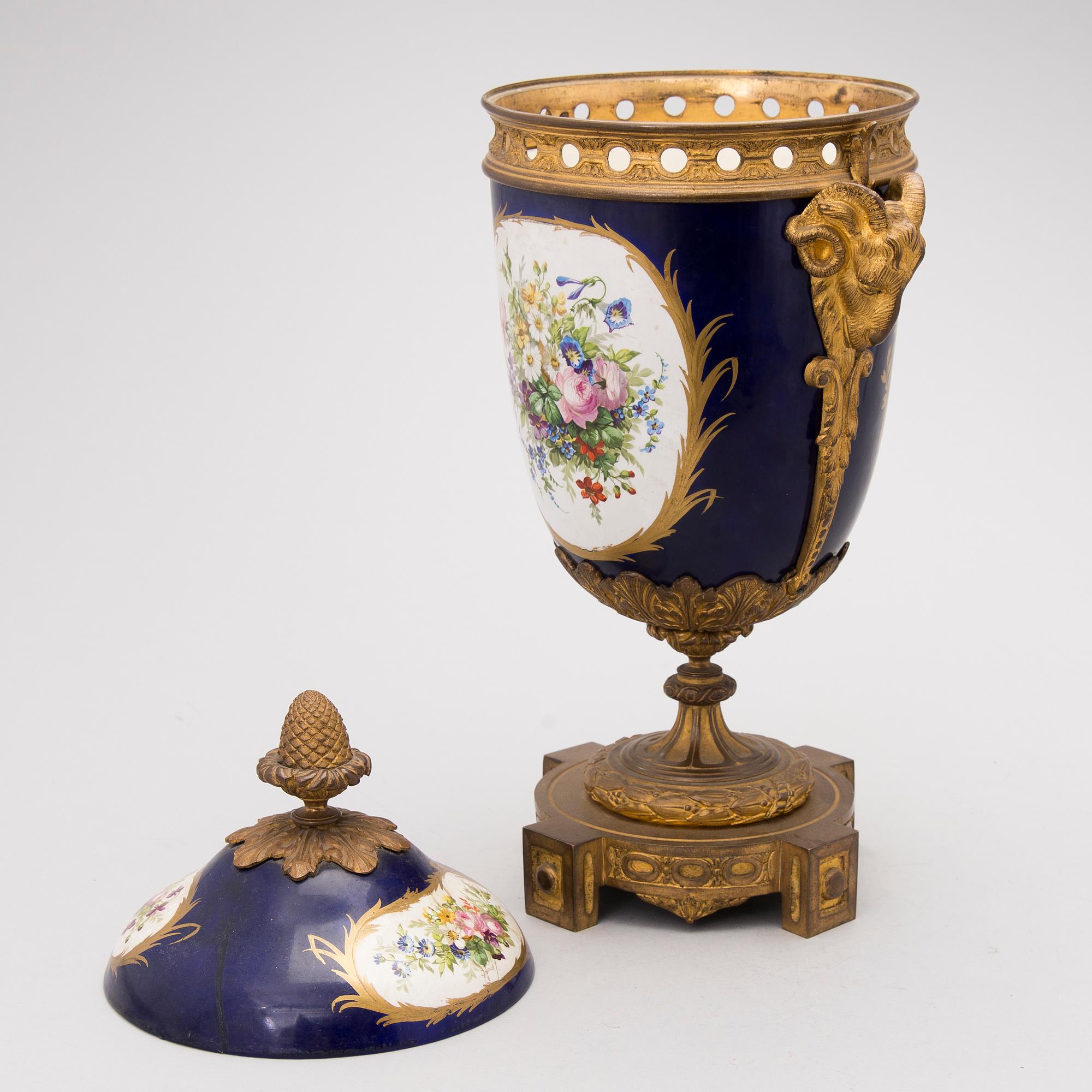 A FRENCH SÈVRES STYLE URN, porcelain and gilt bronze, latter half of the 19th century.