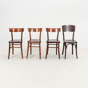 A set of four different early 1900s chairs.