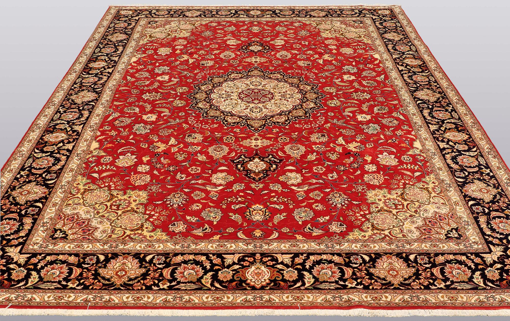 A carpet, Täbriz part silk, 341 x 248 cm.