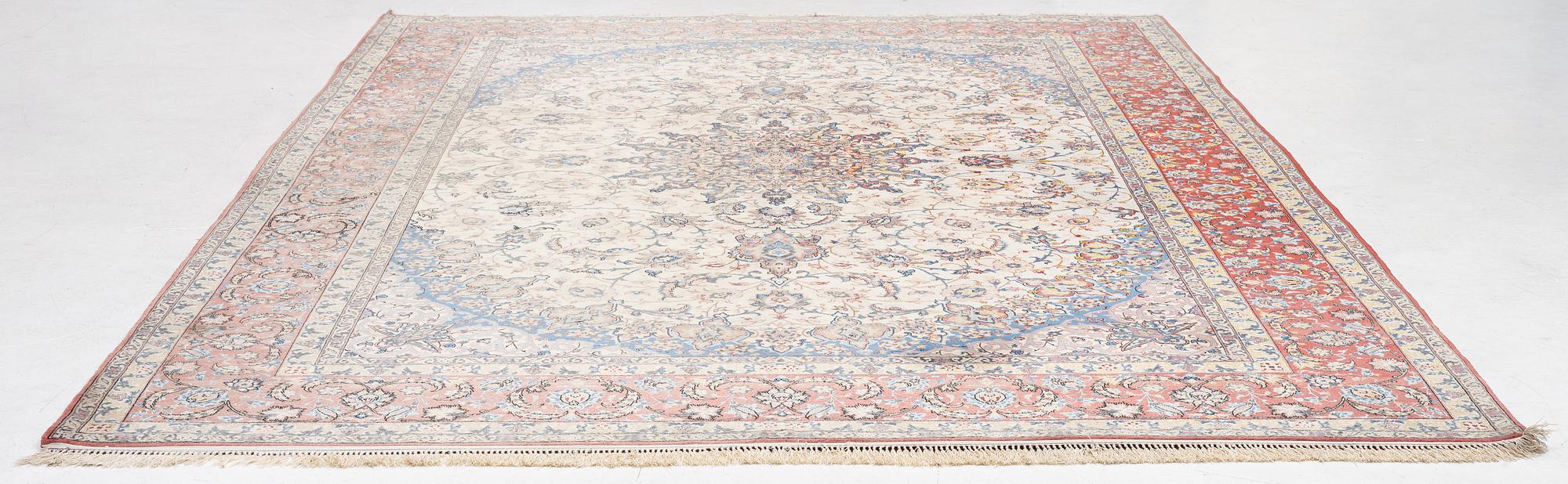 An Isfahan carpet, signed, approx. 372 x 255 cm.