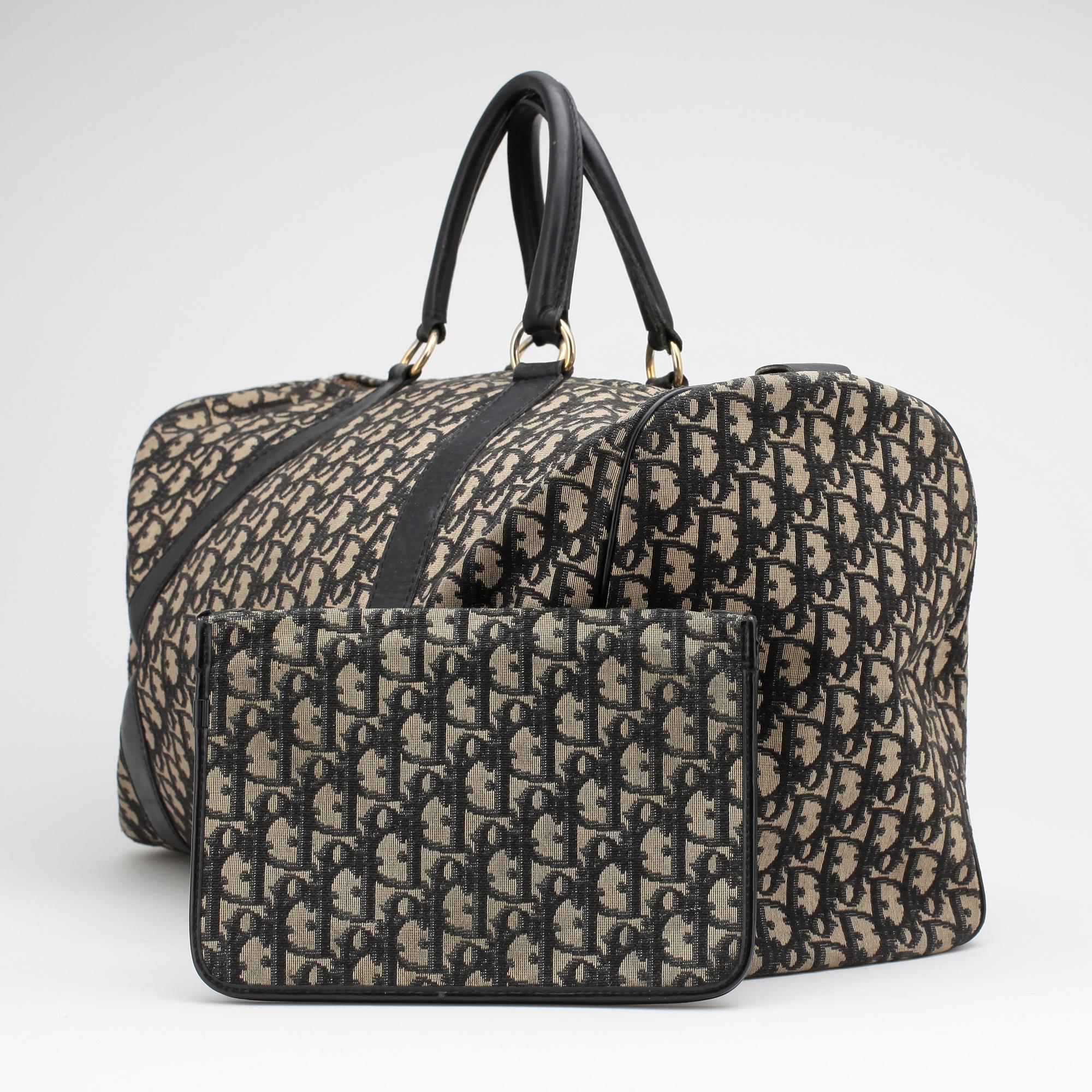 CHRISTIAN DIOR, a black monogram canvas bag and clutch bag.