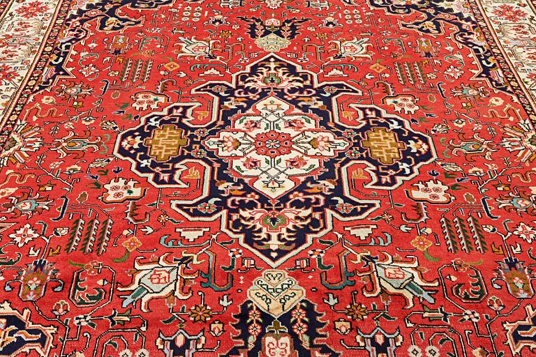 A Tabriz carpet, c. 335 x 257 cm.