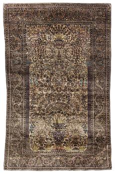 An antique silk Feraghan carpet, c. 195 x 121 cm.