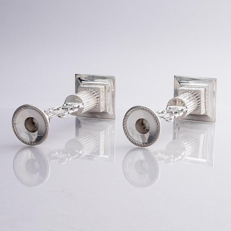 A pair of Swedish silver candlesticks, marks of Gustaf Folcker, Stockholm 1825.