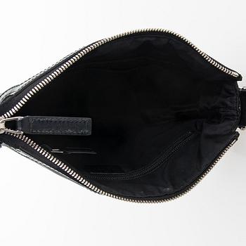 Gucci, a "Techno Canvas Web Messenger" bag.