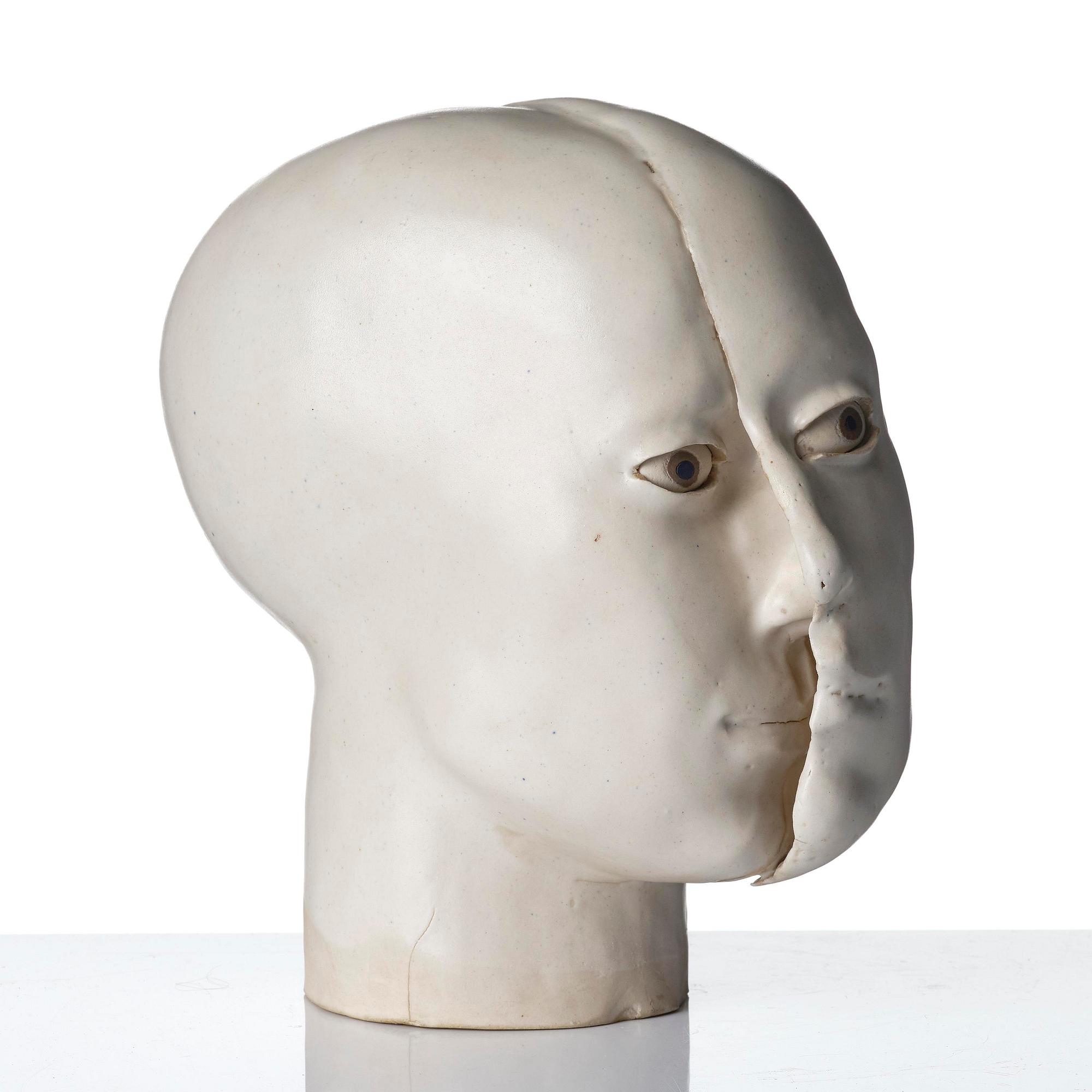 Britt-Ingrid "BIP" Persson, a glazed stoneware sculpture of faces, ca. 1970.