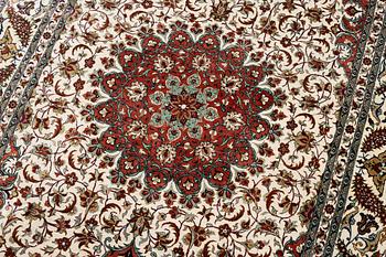 A Ghom silk rug, signed, c. 148 x 100 cm.