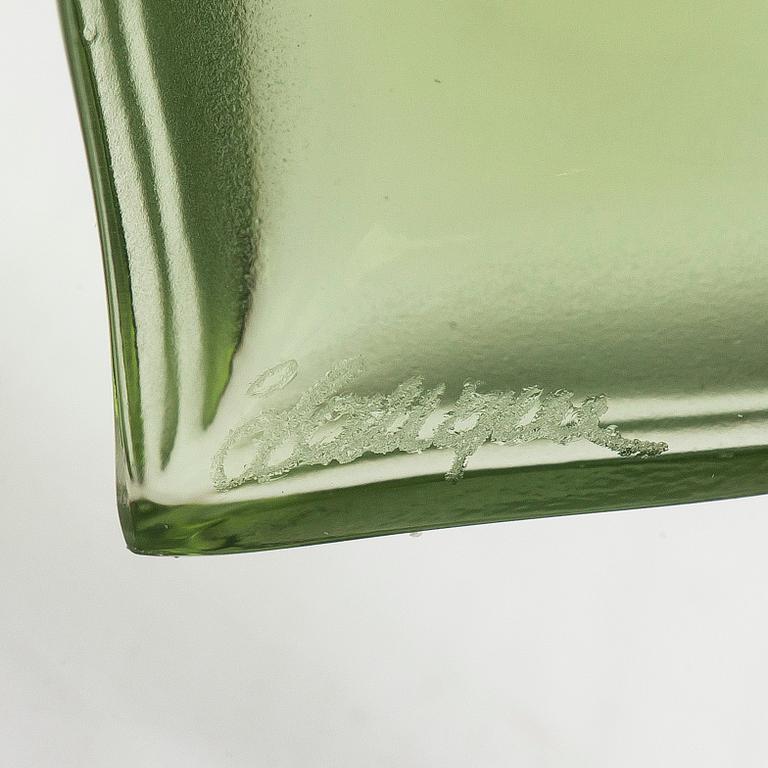 A Lalique heart pendant with an 18K gold chain.