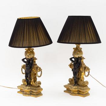 A pair of brass table lamps from around the year 1900.