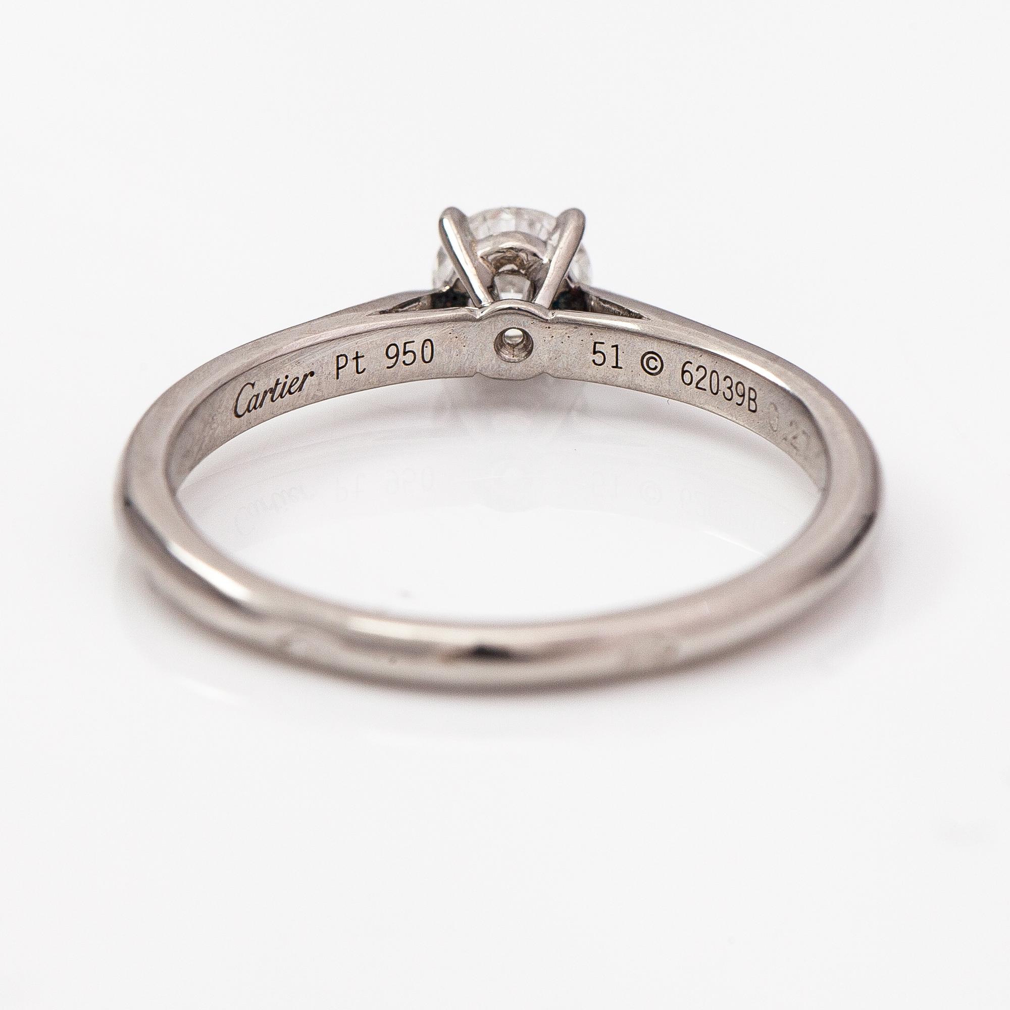 Cartier, A platinum ring with a ca. 0.27 ct diamond according to certificate. Marked Cartier, 51, 62039B.