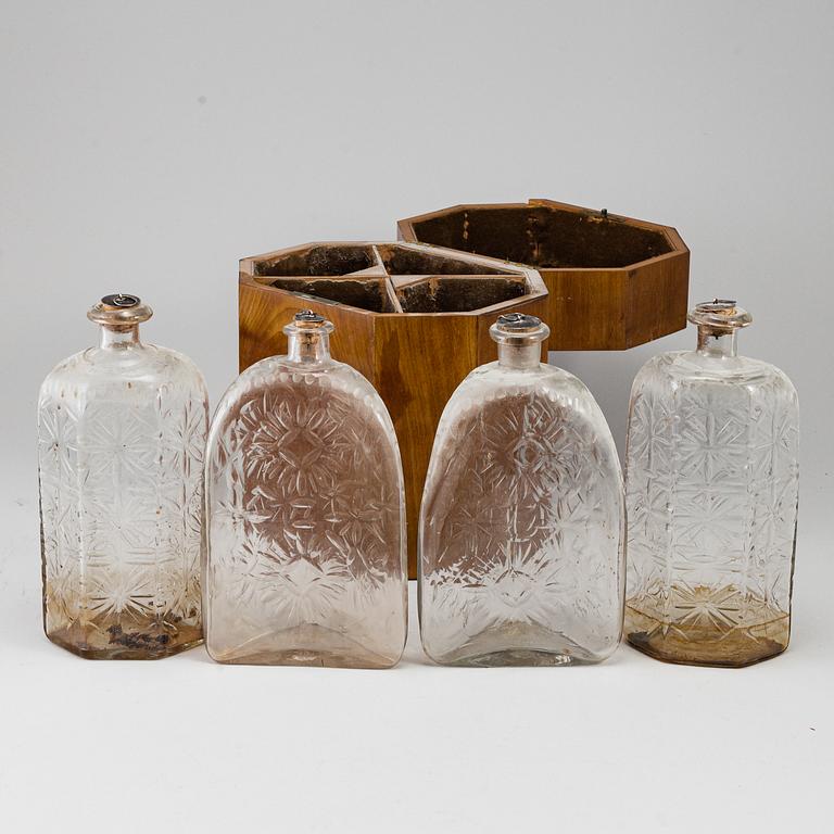 A gustavian style mahogany box with 4 glass bottles, circa 1900.