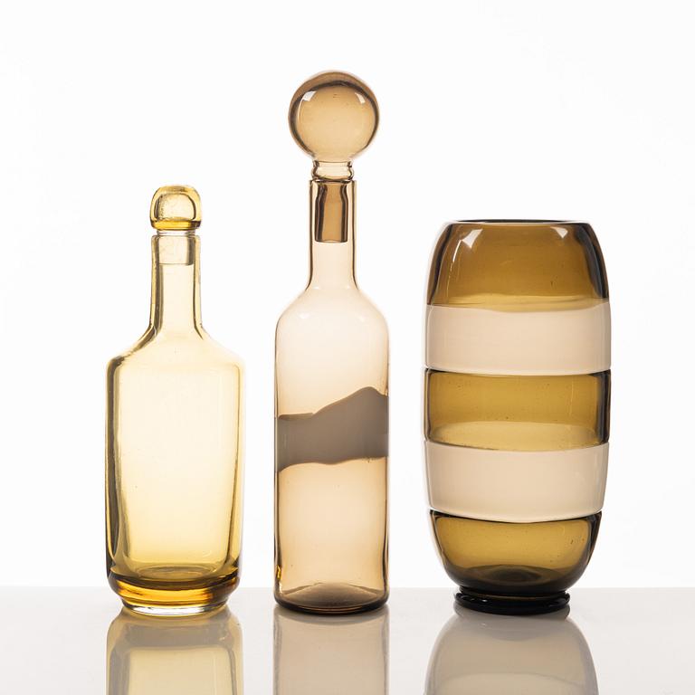 A glass vase and two bottles, including Archimede Seguso and Venini, Murano, Italy.