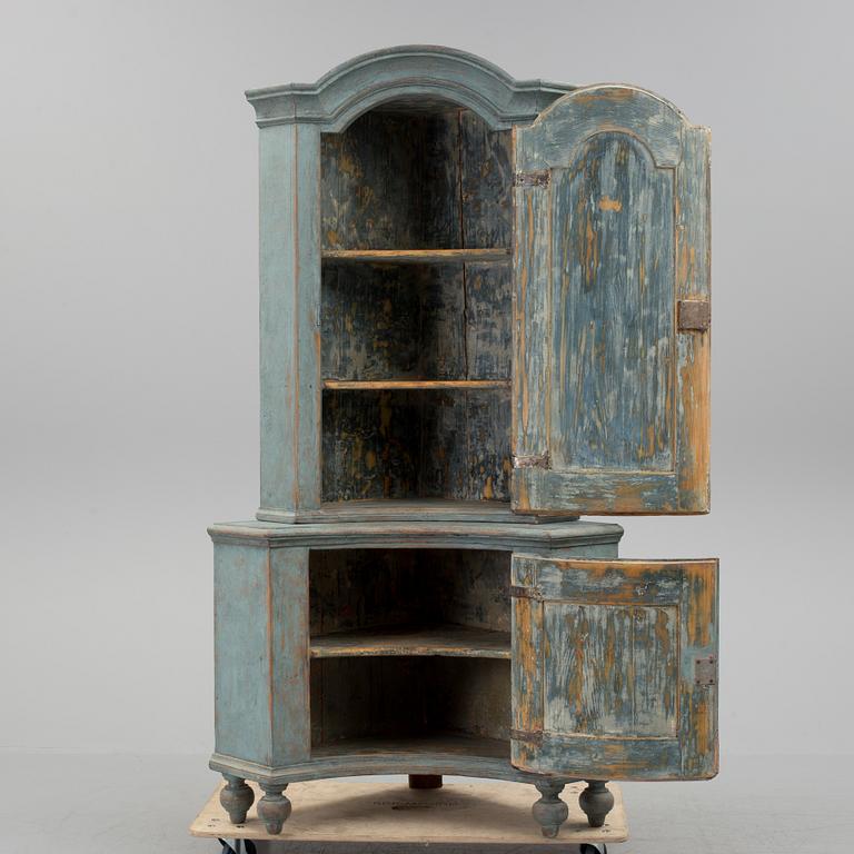 A 18th century corner cabinet.