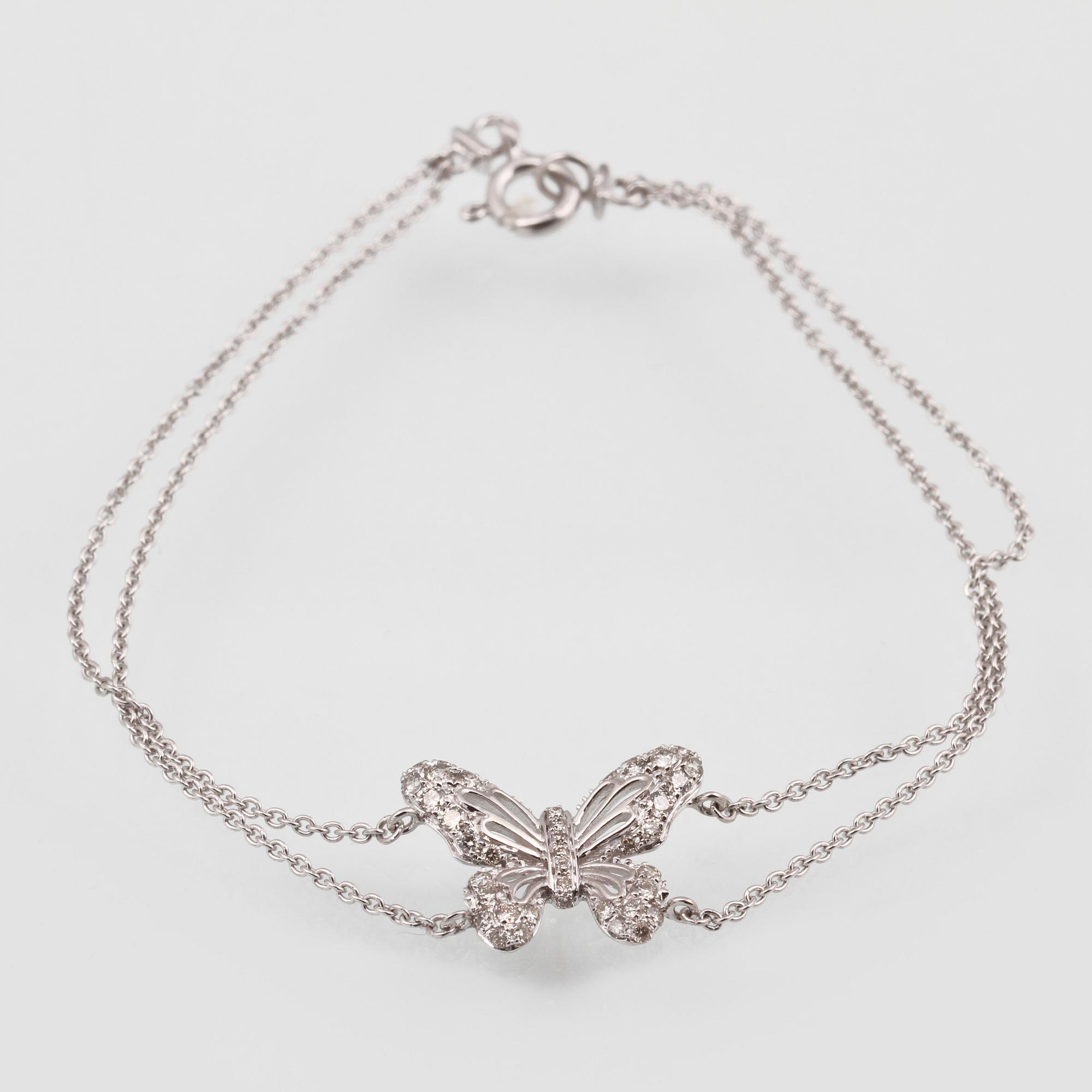ARMBAND, 18K vitguld med briljantslipade diamanter ca 0.36 ct. Vikt 2,7 gram.