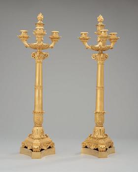 A pair of French Empire early 19th century four-light candelabra.