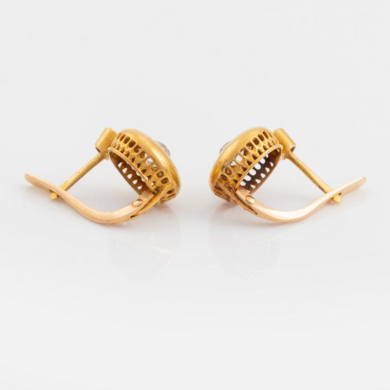 A pair of 18K gold earrings set with old-cut diamonds.