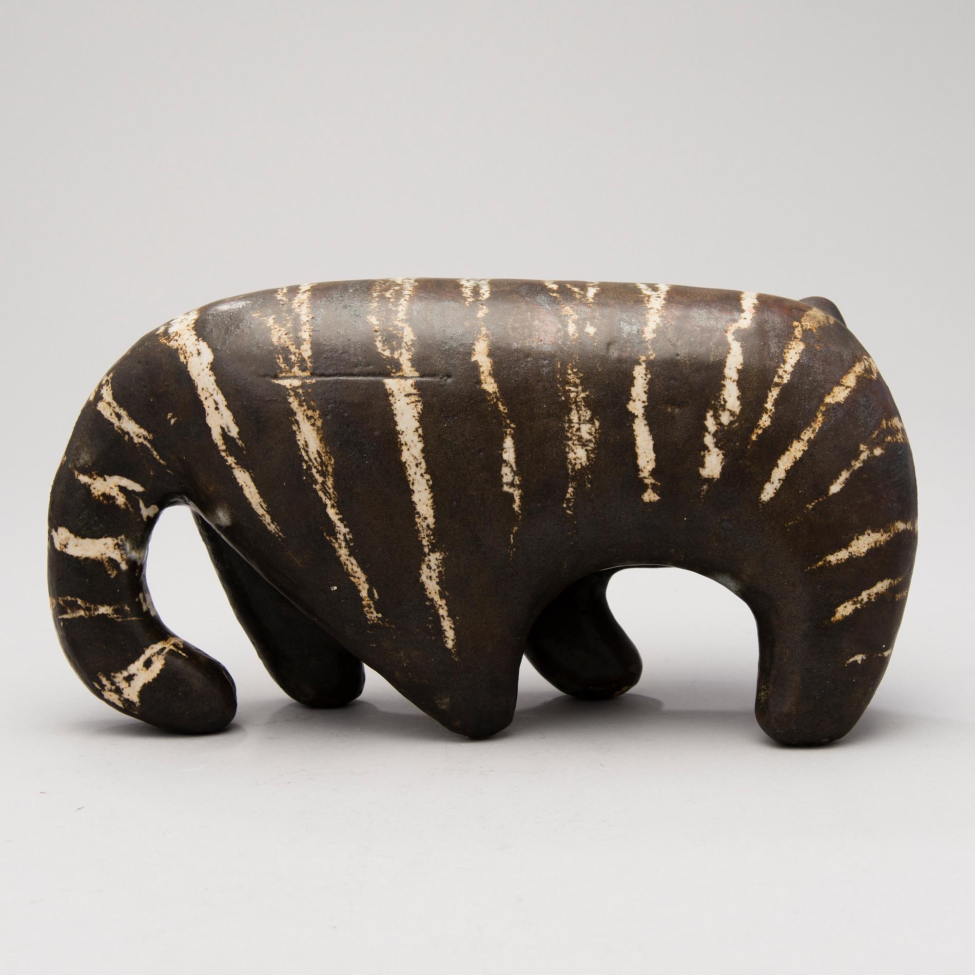 A Ceramic Figurine, signed T Kaasinen Arabia Finland.