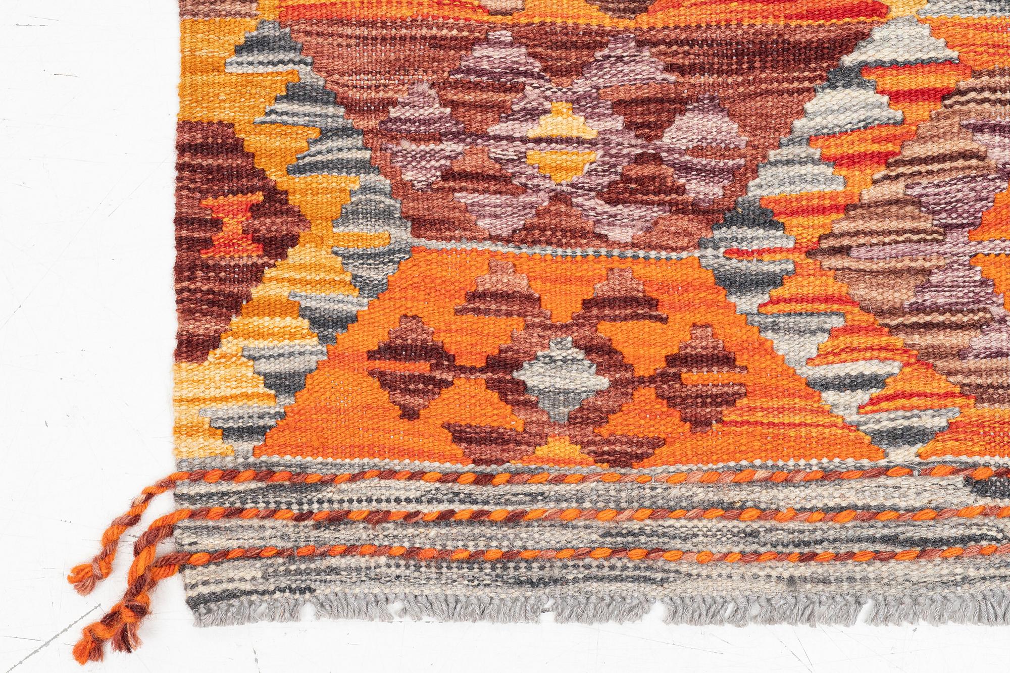 A Kilim runner, c. 255 x 85 cm.