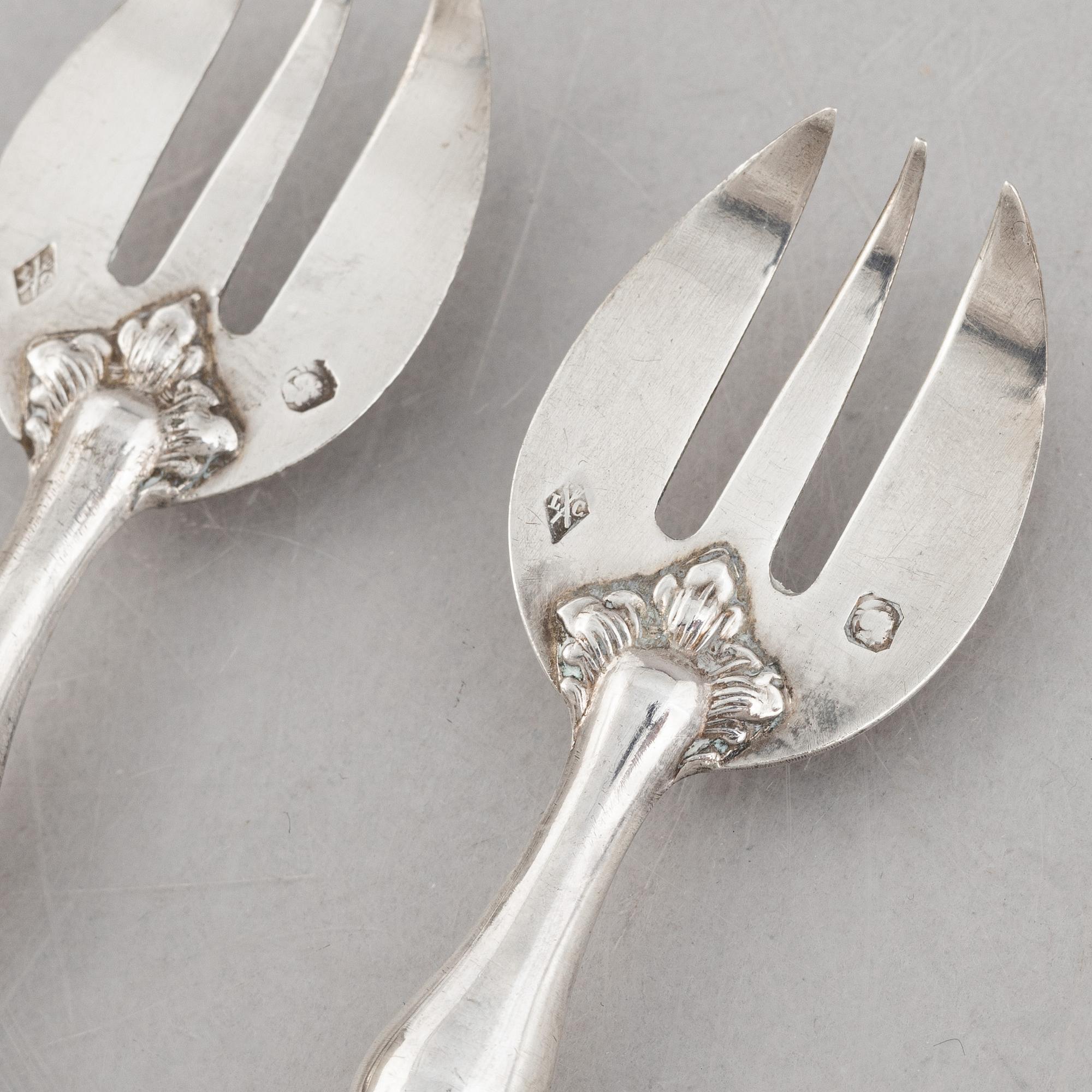 A set of twelve French silver oyster forks, mark of Louis Coignet