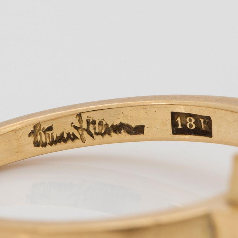 Wiwen Nilsson, an 18k gold ring with a facet cut rock crystal, Lund 1962.