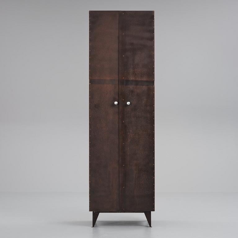 A contemporary patinated metal cabinet.